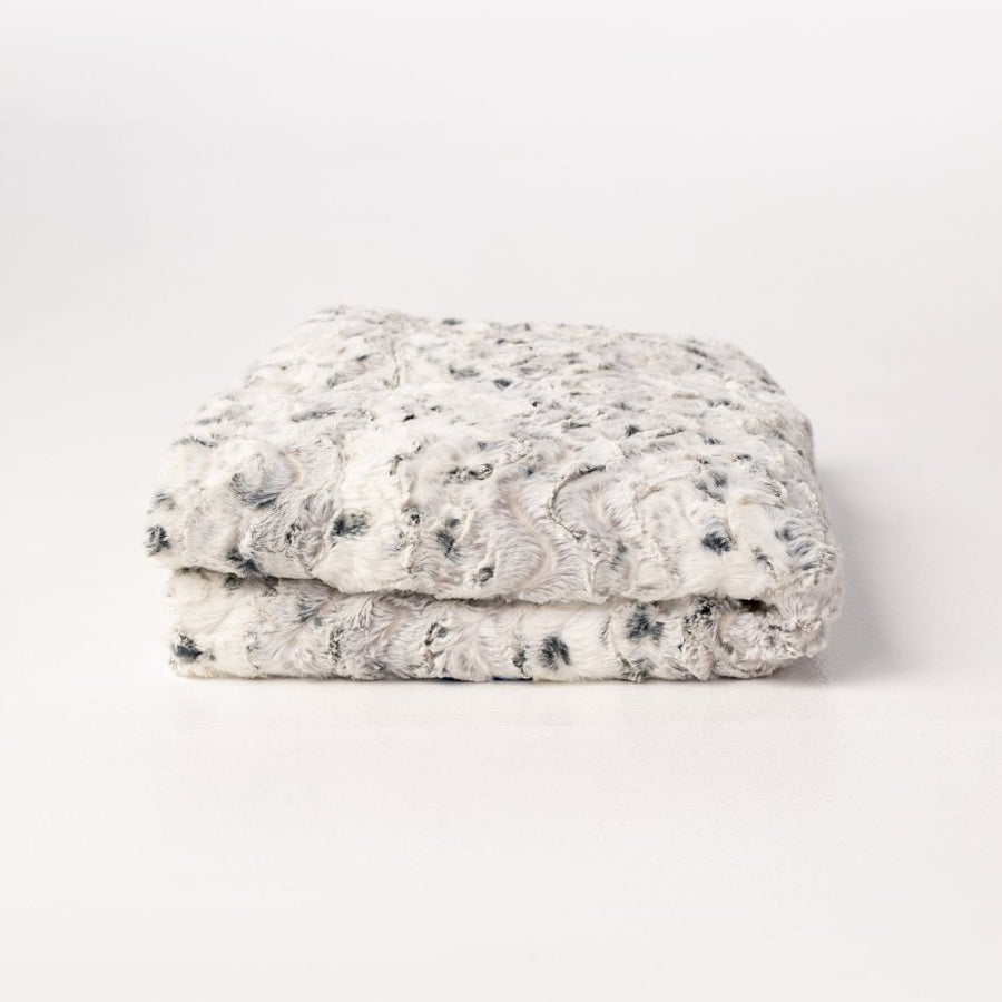 Alloy Gray Cream White Throw in ultra soft high quality faux fur folded.
