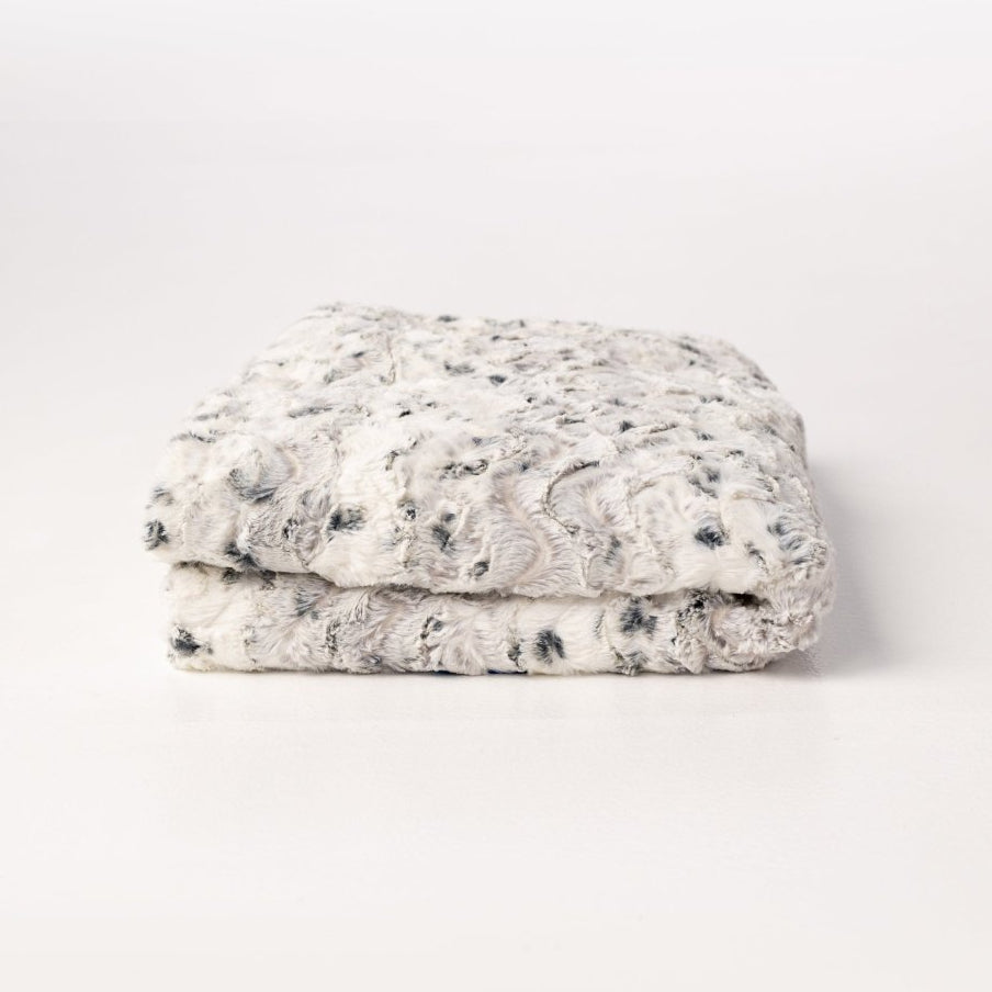 Alloy Gray Cream White Throw in ultra soft high quality faux fur folded.