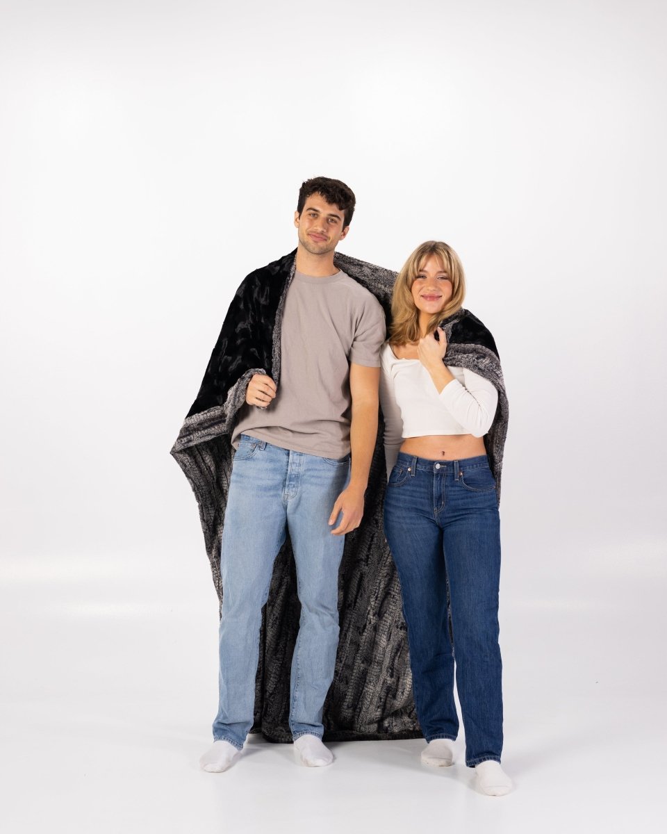 Black Birch Throw luxurious super soft faux fur oversized blanket wrapped around a couple
