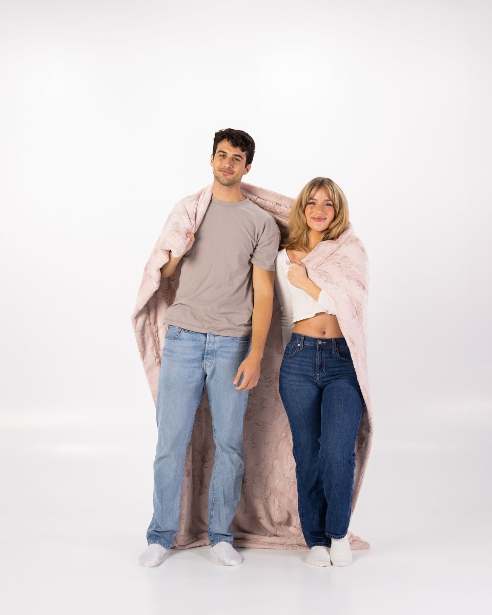 Blush Pink Bella Throw soft faux fur blanket wrapped around couple