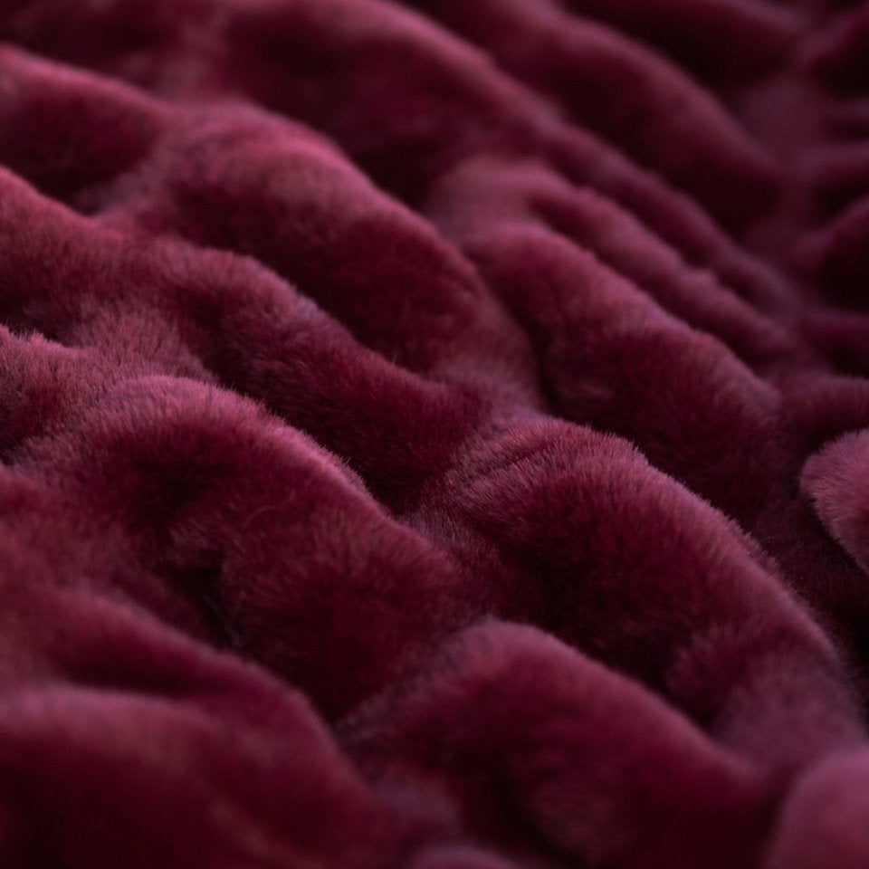 Bordeaux Cloud Throw, a burgundy color, draped to show soft texture and high quality luxury blanket