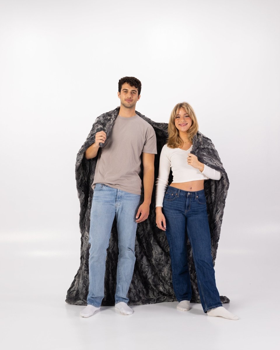 Charcoal Dark Gray Throw soft faux fur blanket wrapped around couple