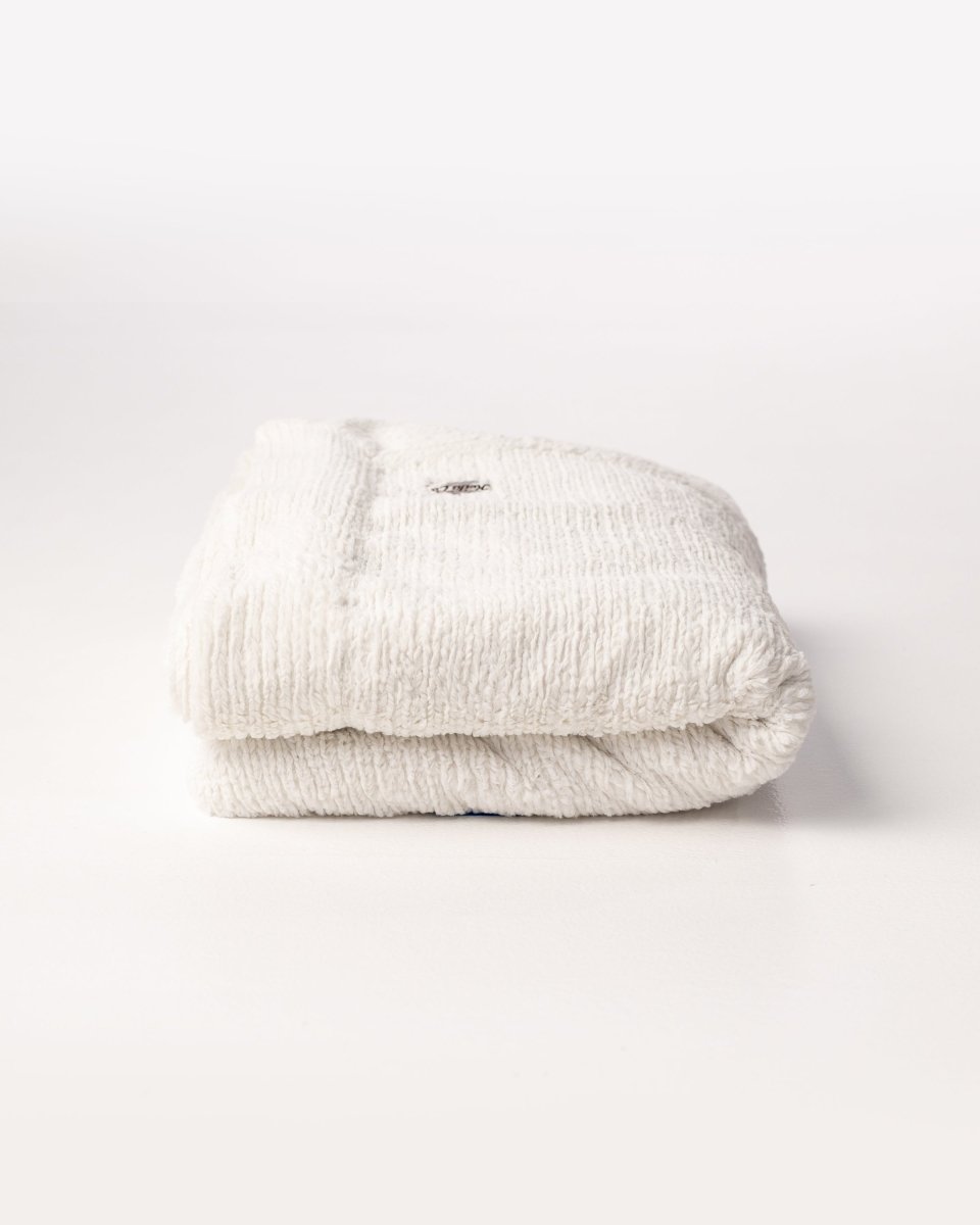 Ivory Weave Cream White Throw in ultra soft blanket folded.