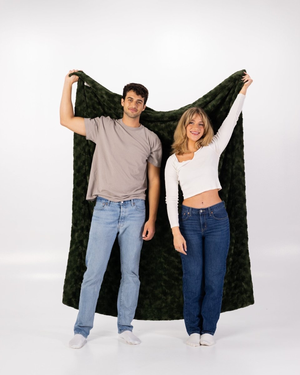 Loden Green Throw soft faux fur oversized blanket held by couple