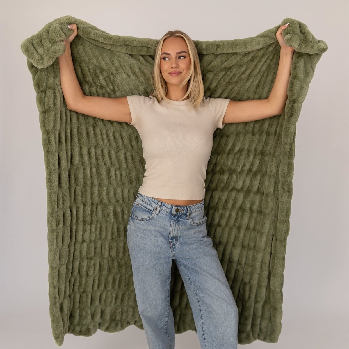 Soft Faux Fur Moss Green Cloud Throw Blanket Worn By Woman In Home