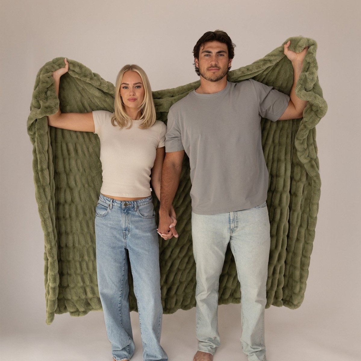 Soft Faux Fur Moss Green Cloud Throw Blanket Held By Couple