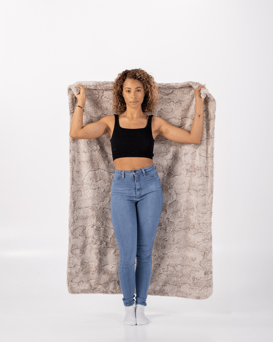 Quartz Tan Throw soft faux fur everyday blanket held by woman