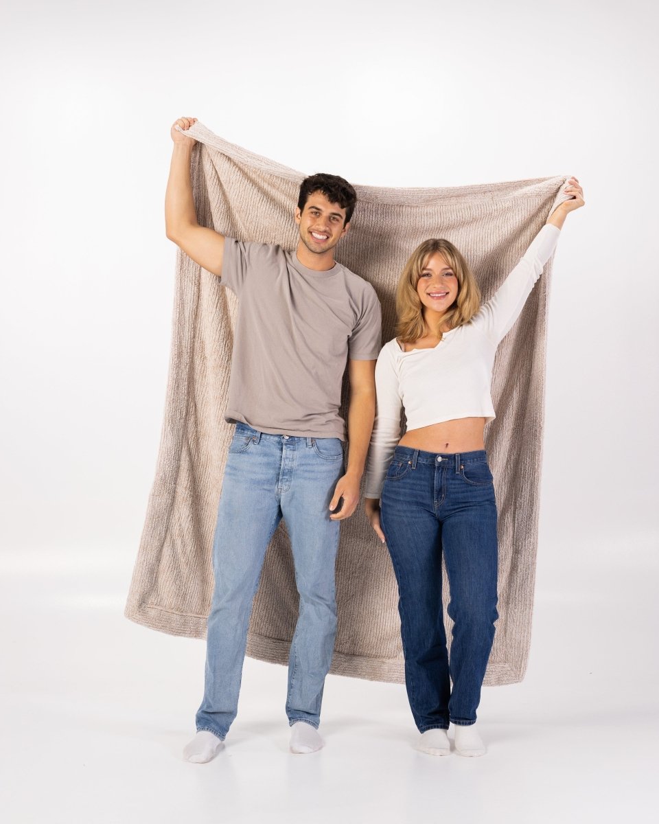 Quartz Tan Weave Throw soft woven oversized blanket held by couple