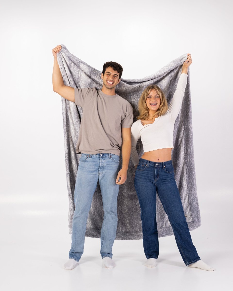 Silver Blue Gray Fawn Throw soft faux fur oversized blanket held by couple