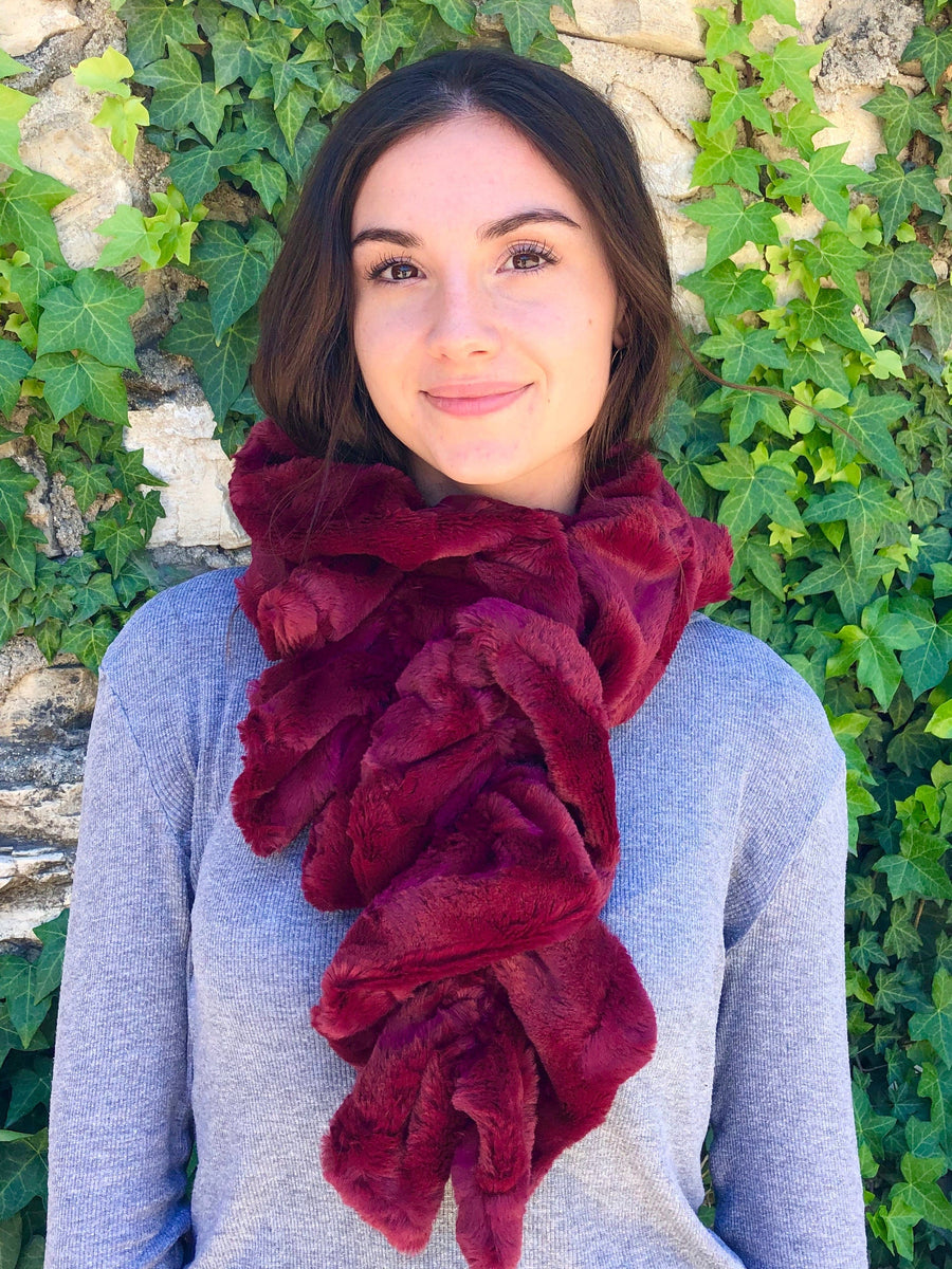 women keeping her Neck Warm with a scarf-like dark red colored Neck Warmer which is the called the Crimson Neck Warmer