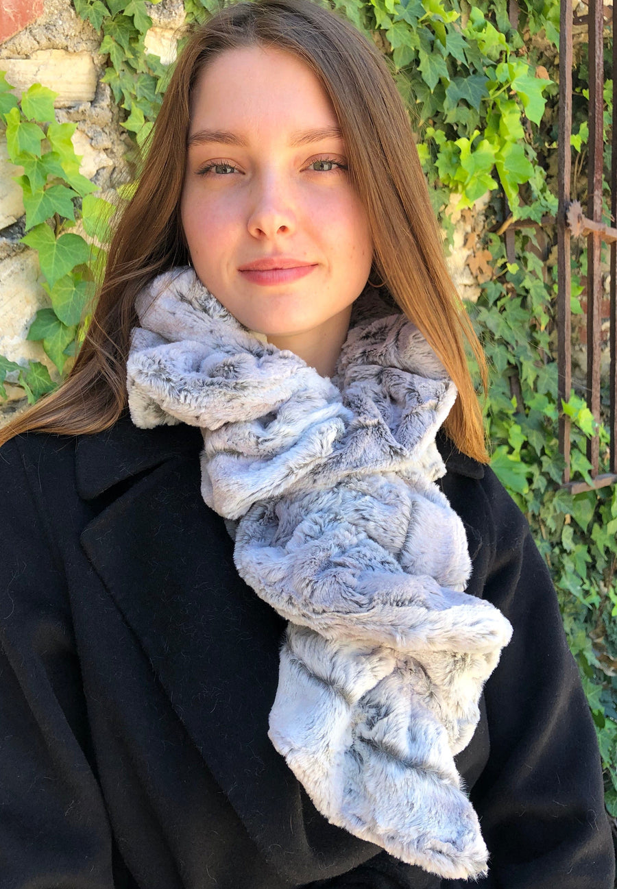 women keeping her Neck Warm with a scarf-like part silver and part dark brown-red colored Neck Warmer which is the called the Silver Fox Neck Warmer