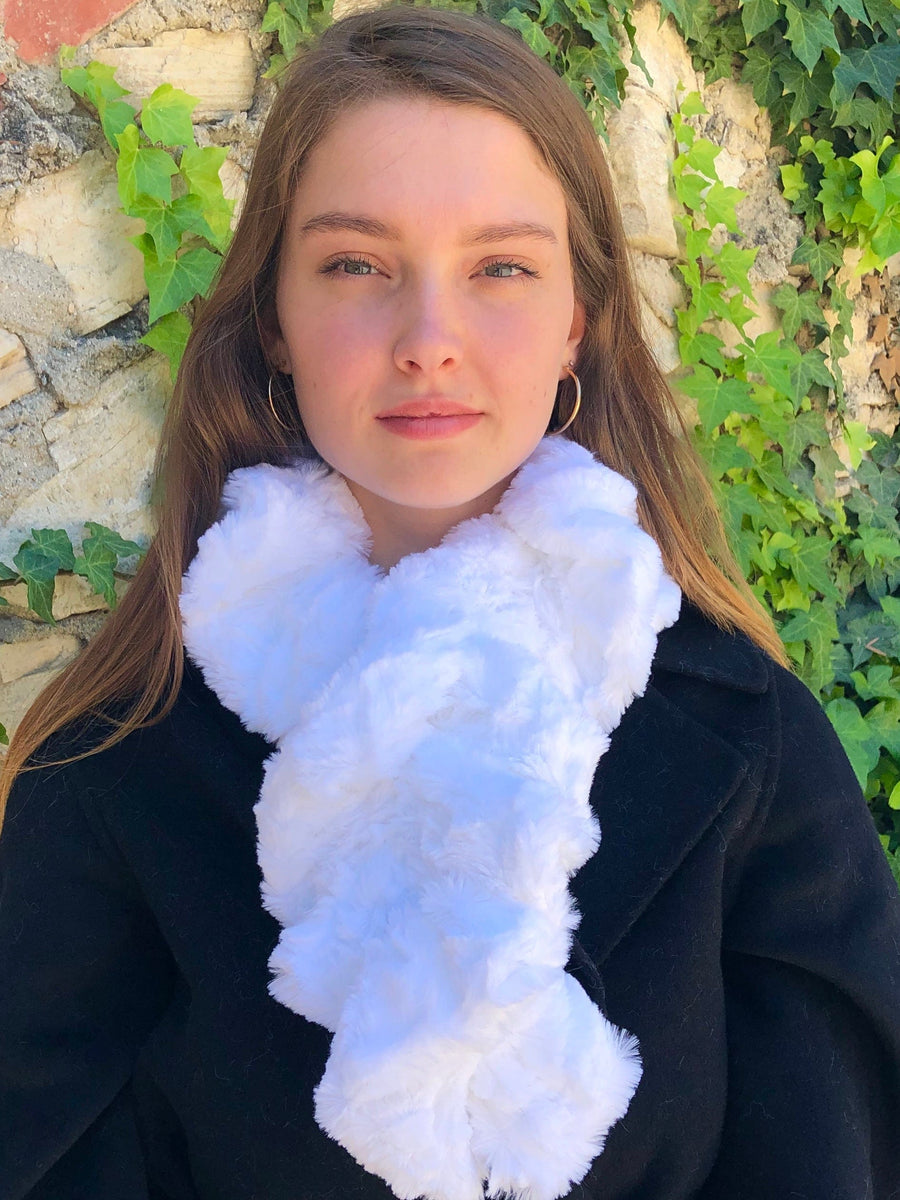 women keeping her Neck Warm with a scarf-like fluffy white colored Neck Warmer which is the called the White Neck Warmer