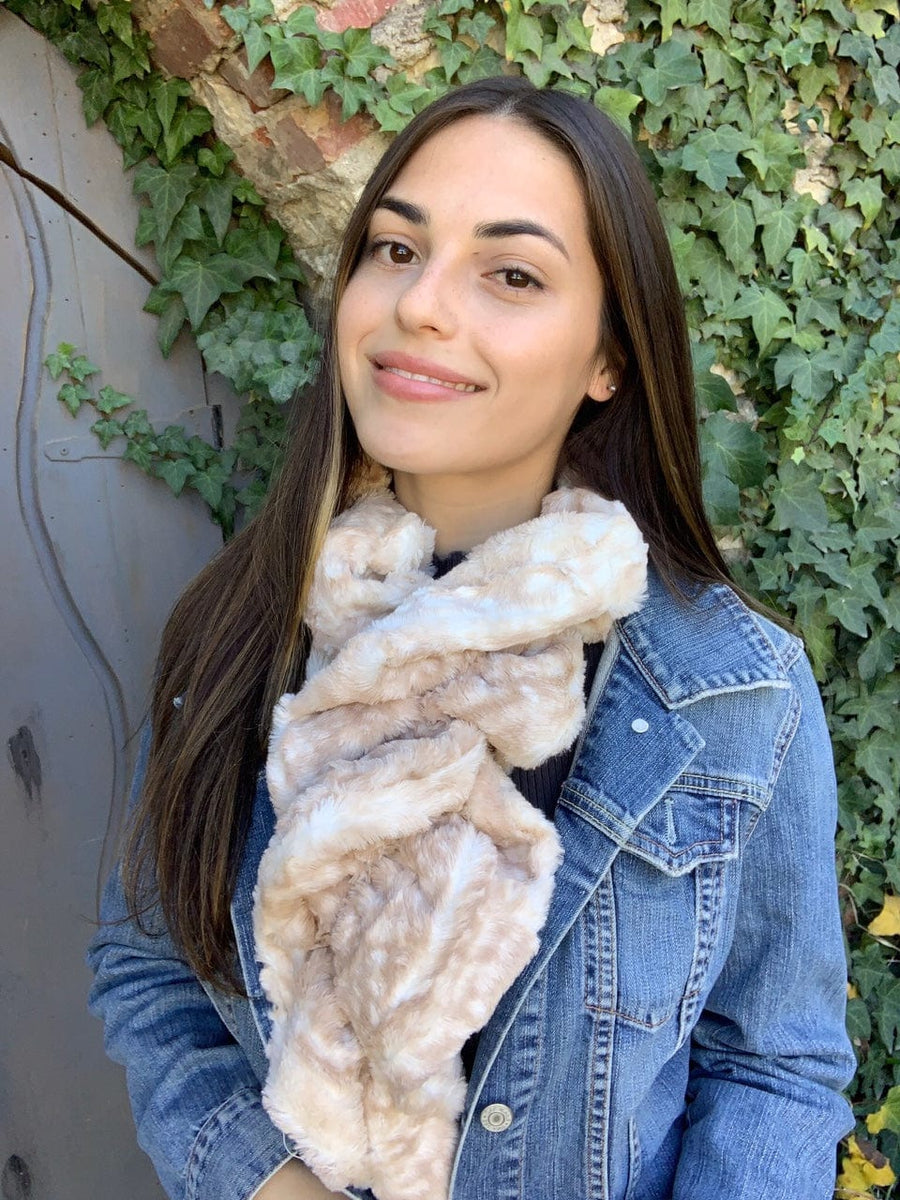 women keeping her Neck Warm with a scarf-like light-brown with soft white dots colored Neck Warmer which is the called the Beige Fawn Neck Warmer