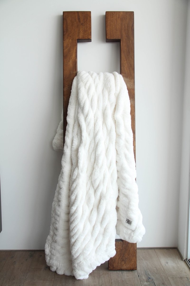 Ivory White Cloud Throw ultra soft luxury faux fur weighted blanket draped in living room