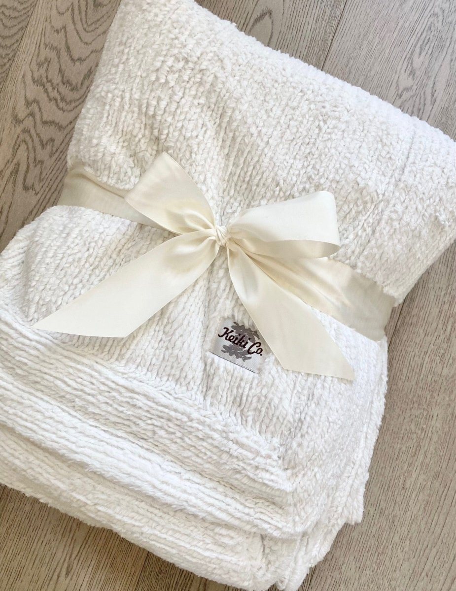 Ivory Weave Cream White Throw ready for gifting, gift wrapped with bow for holidays.