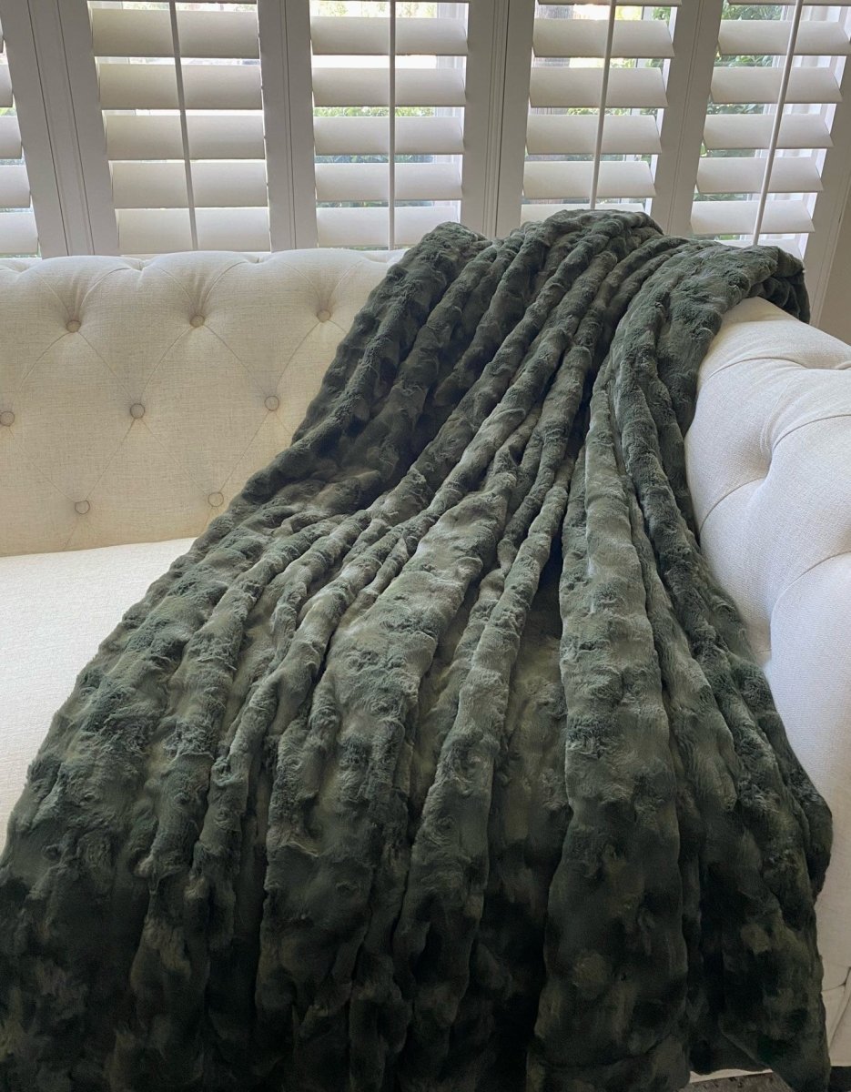 Loden Green Throw soft faux fur blanket draped living room couch home