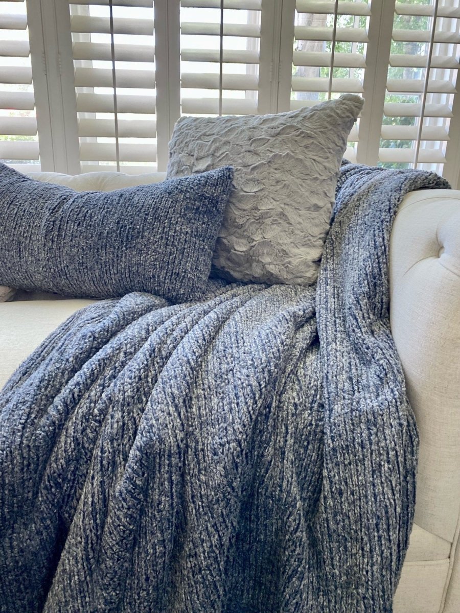Navy Blue Weave Throw in ultra soft blanket held draped on living room couch in home