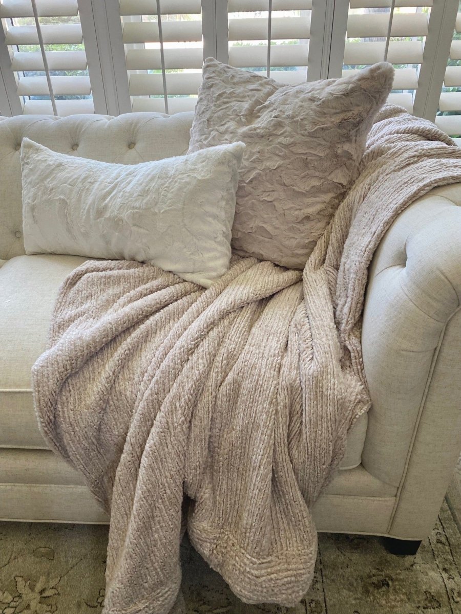Quartz Tan Weave Throw soft woven blanket draped on living room couch in home