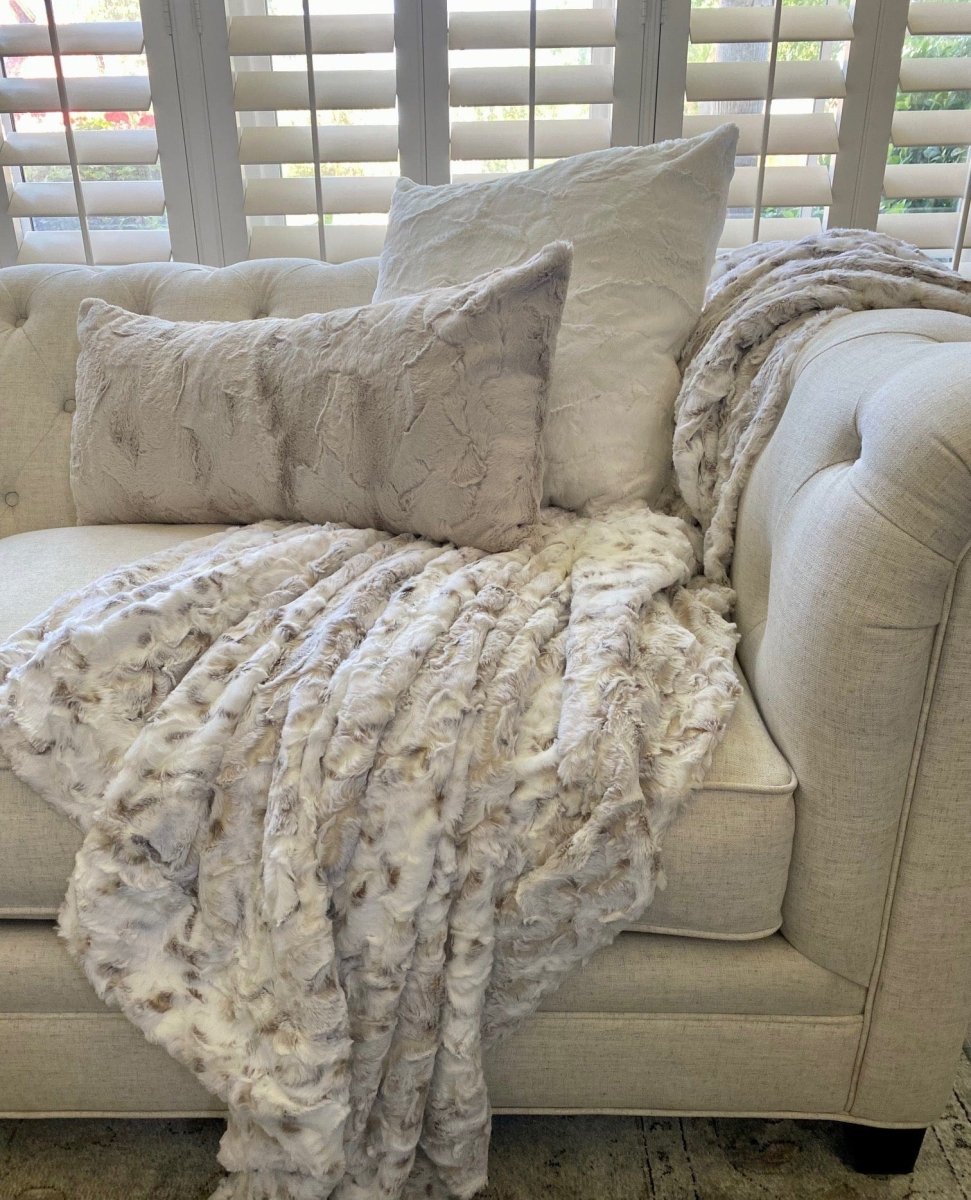 Snowy Owl Cream Throw soft faux fur blanket draped living room couch home
